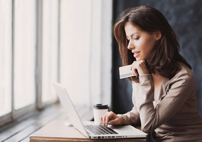Photo: Woman paying bill online